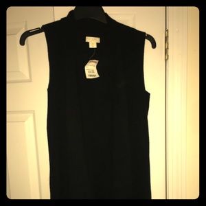 Black long ribbed open sweater with side zippers.